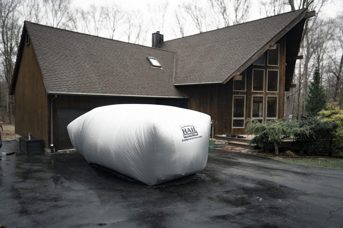 The Hail Protector System deployed and fully inflated on a vehicle